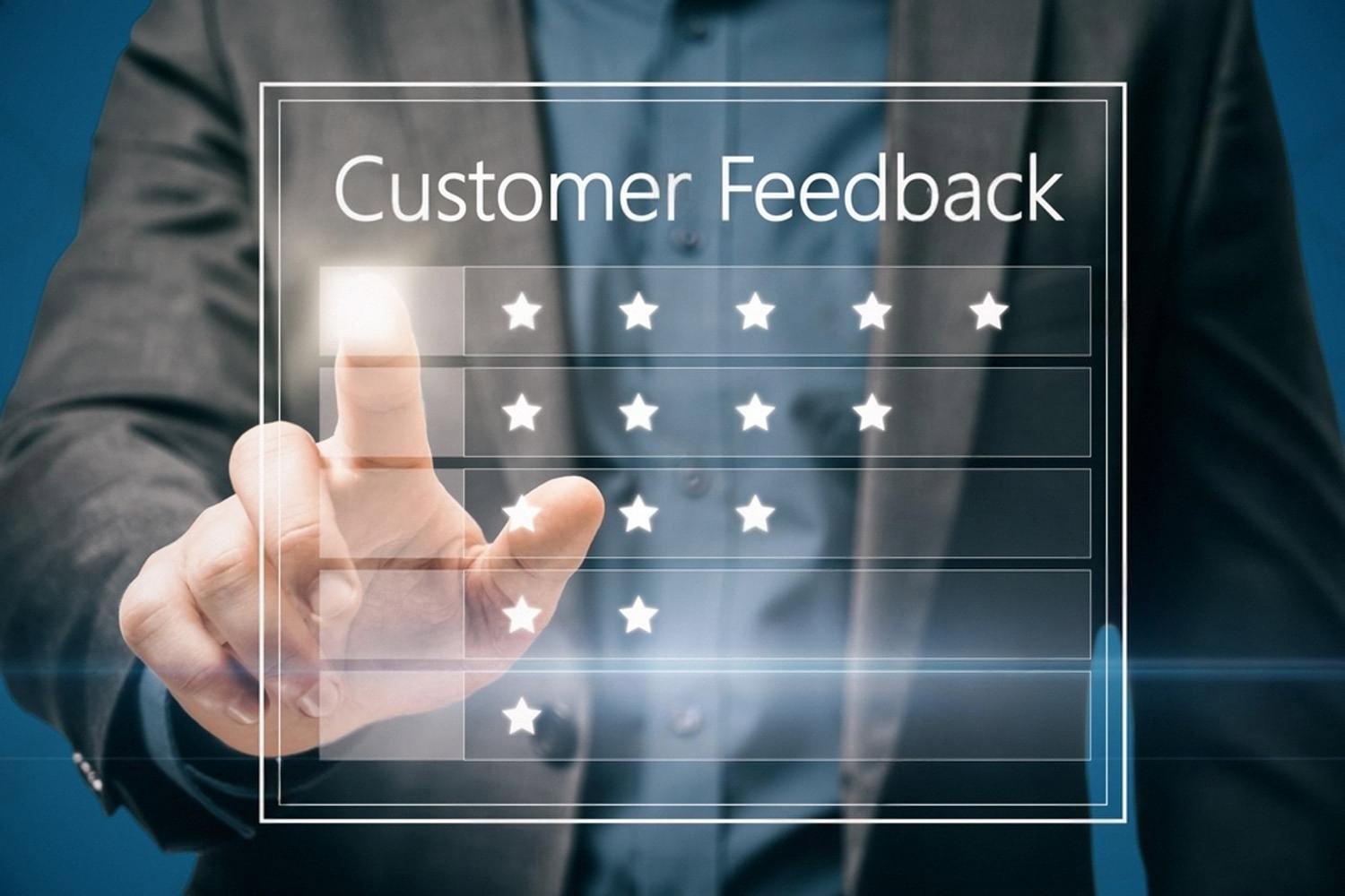 Hand selecting stars on a digital customer feedback panel to rate a UAE business